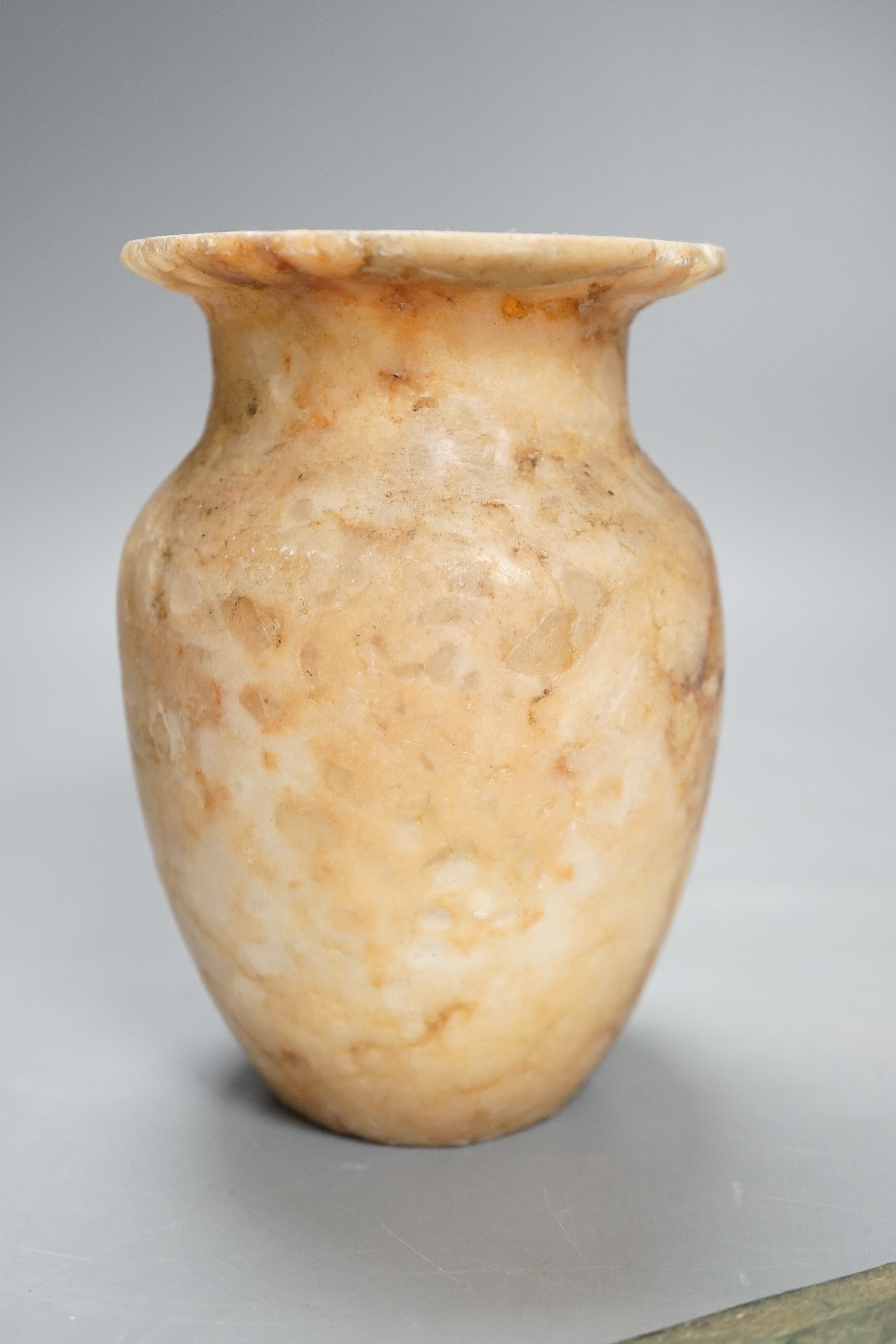 Antiquities to include a Luristan bronze spear head, an Egyptian ushabti (af) and an alabaster jar, spear head 30.5cm long